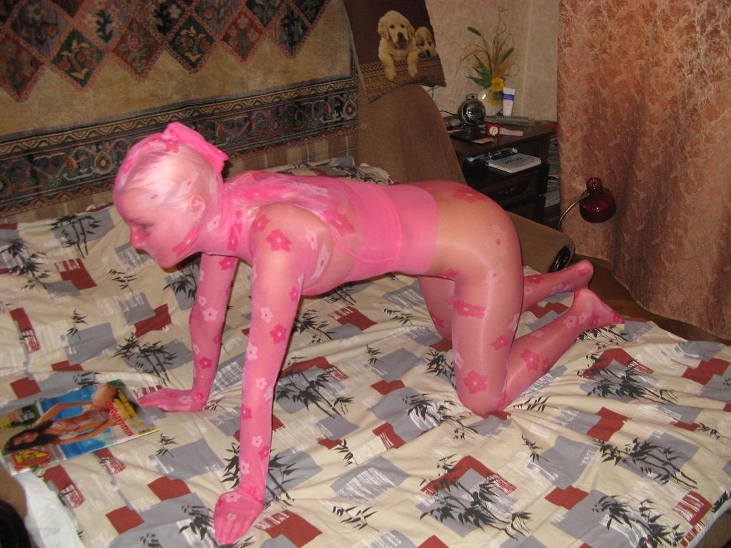 Blonde Girl Totally encased in Pink Sheer Patterned Shiny Nylon Pantyhose